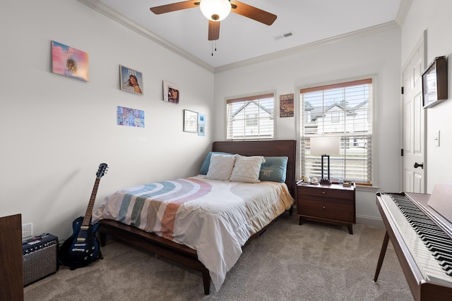 bedroom with crown molding, ceiling fan, and light carpet