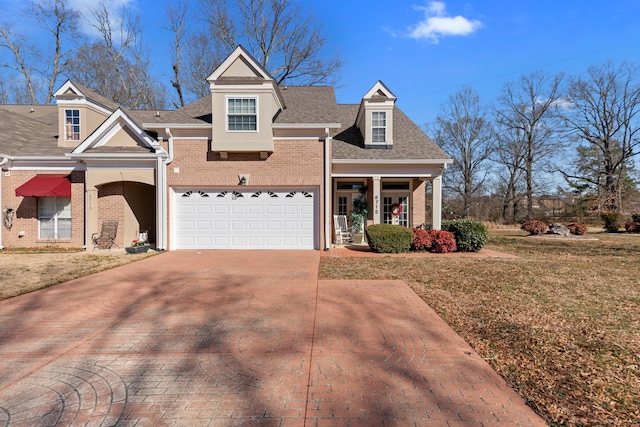 view of front of house with a garage and a front yard