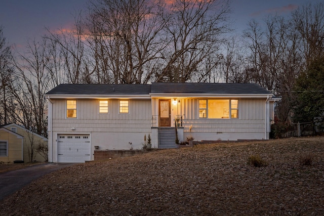 ranch-style home featuring a garage