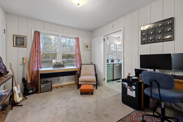 carpeted office space featuring sink