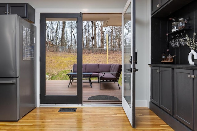 entryway with light hardwood / wood-style floors