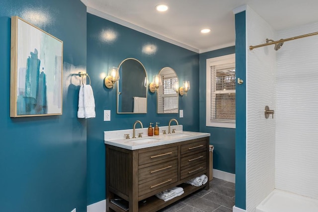 bathroom featuring vanity, ornamental molding, and tile patterned flooring