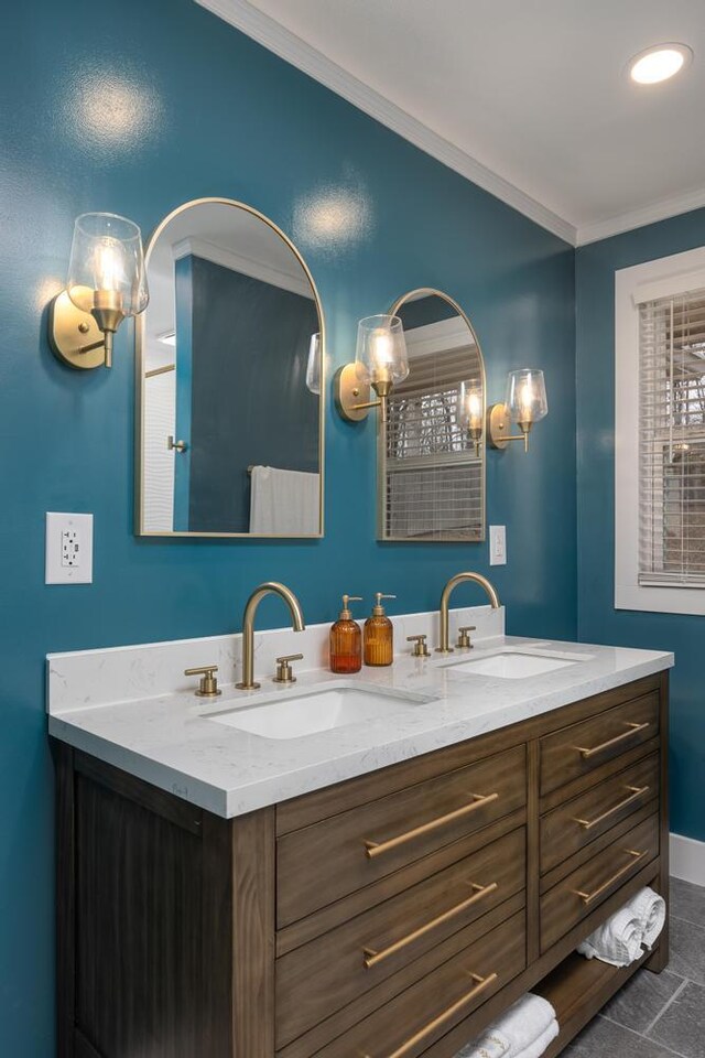 bathroom featuring crown molding, tile patterned floors, and vanity