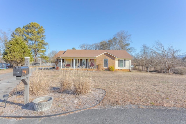 single story home featuring covered porch