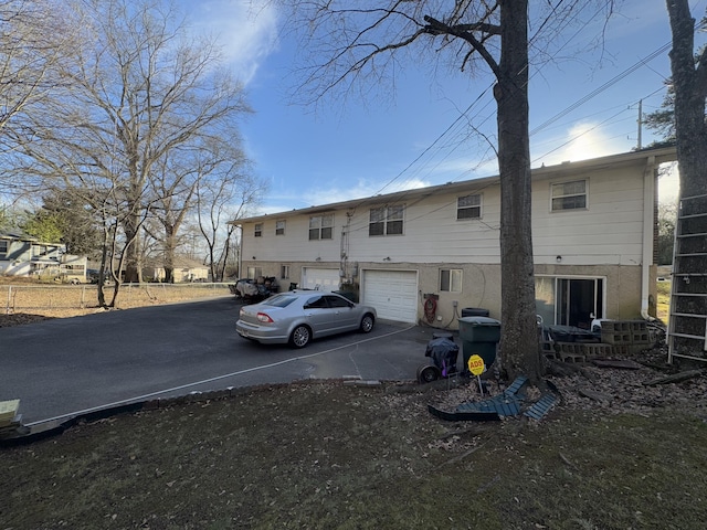 back of property featuring a garage