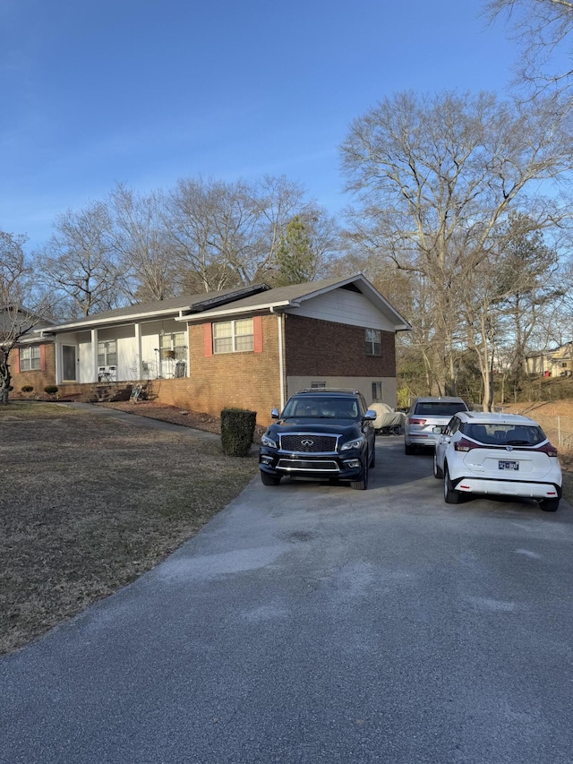 view of side of home featuring a porch