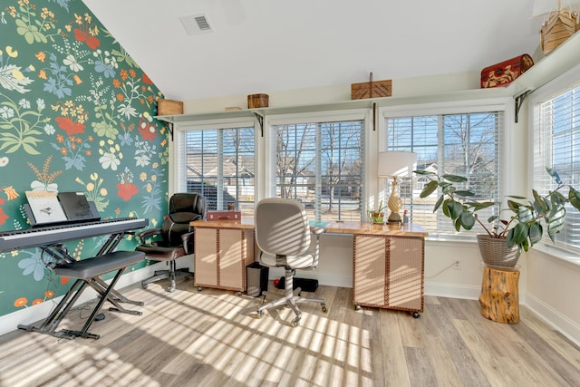 office area featuring a wealth of natural light and light hardwood / wood-style floors