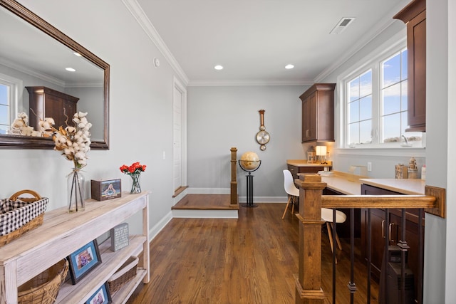 corridor featuring crown molding and dark hardwood / wood-style flooring