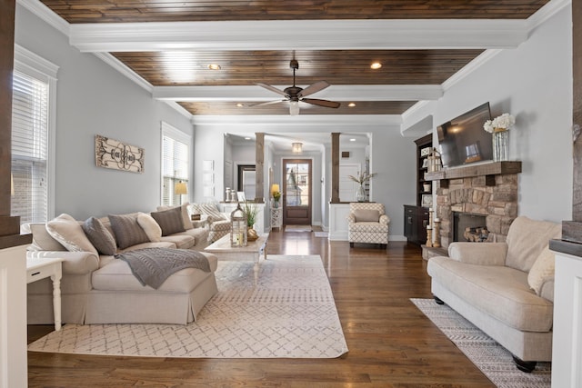 living room with beam ceiling, dark wood-type flooring, and ornamental molding