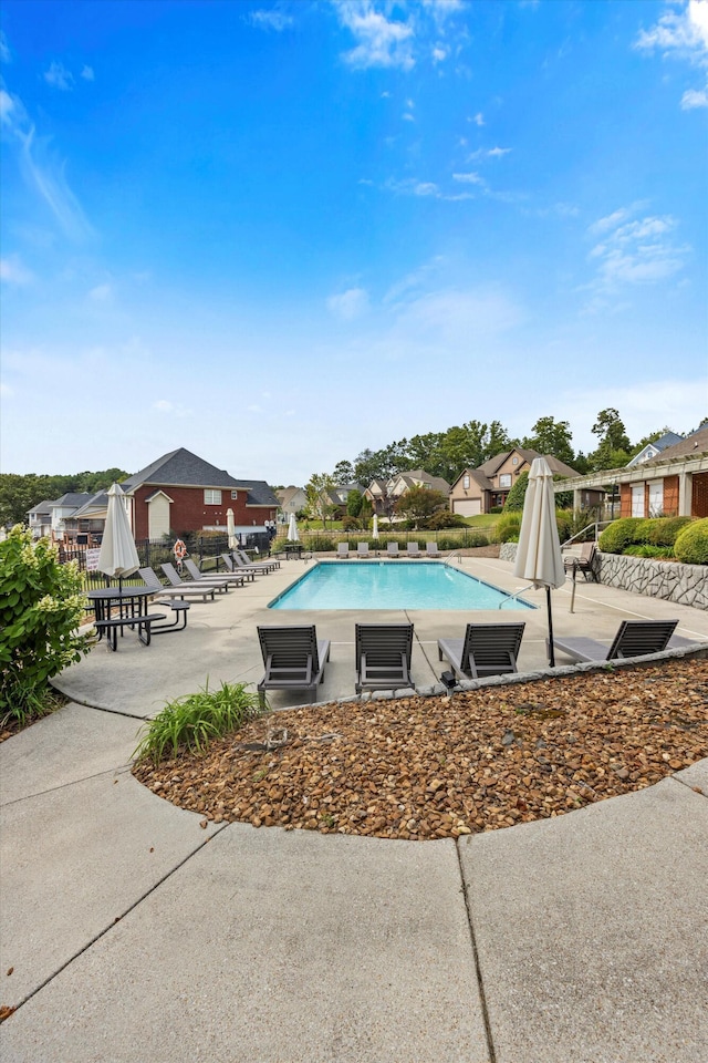 view of swimming pool with a patio area