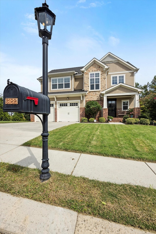 view of front facade with a garage and a front lawn