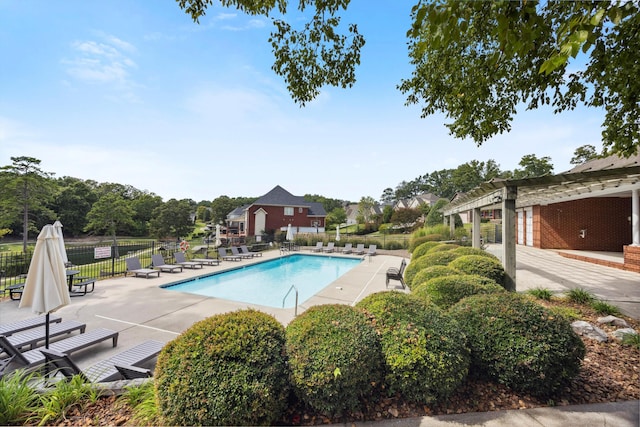 view of swimming pool featuring a pergola and a patio