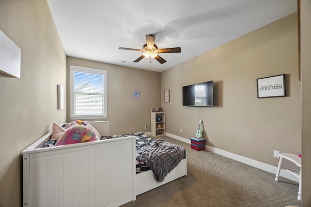 bedroom featuring ceiling fan and carpet