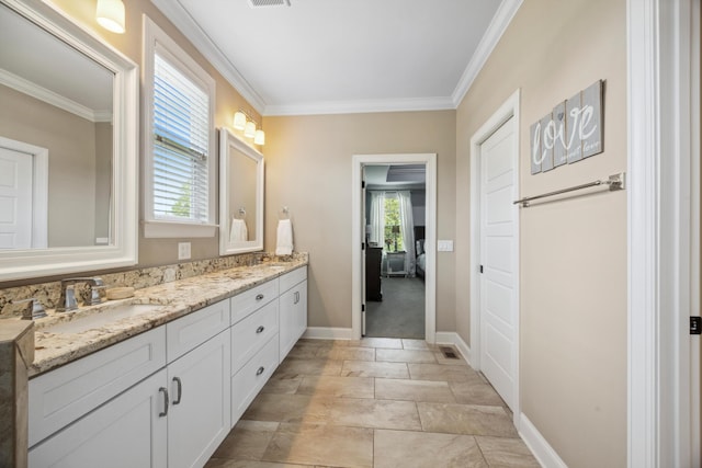 bathroom featuring vanity and ornamental molding