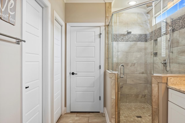 bathroom featuring walk in shower and vanity