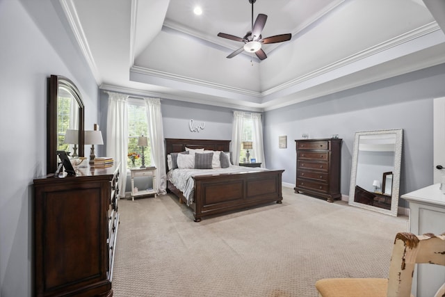 bedroom with crown molding, light colored carpet, a raised ceiling, and ceiling fan