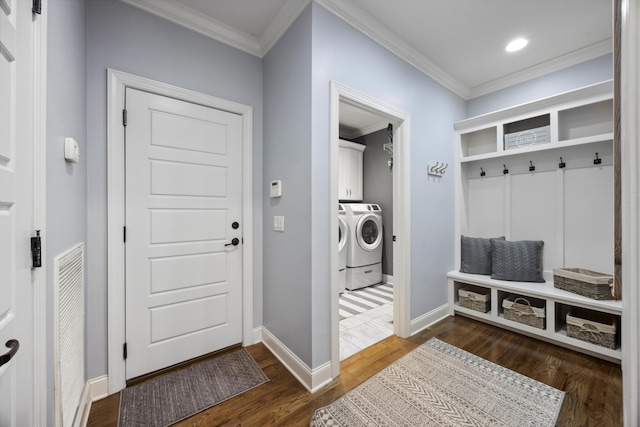 mudroom featuring ornamental molding, separate washer and dryer, and dark hardwood / wood-style flooring