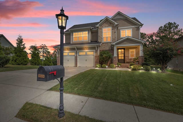 view of front facade featuring a garage and a yard