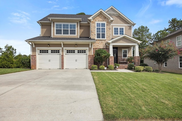 craftsman inspired home with a garage and a front yard