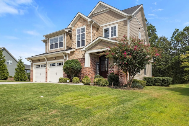 craftsman inspired home featuring a garage and a front lawn