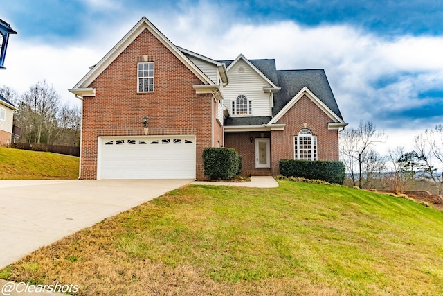 view of front property featuring a garage and a front lawn