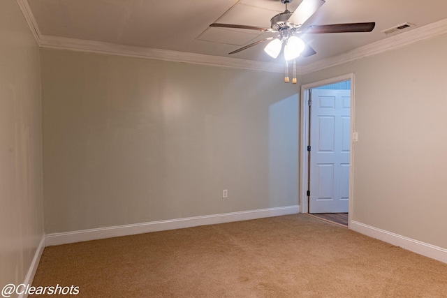 spare room featuring crown molding, ceiling fan, and carpet