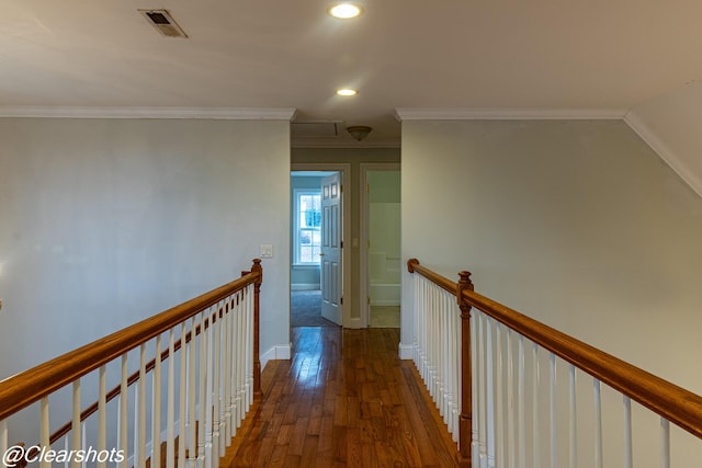 corridor with crown molding and dark hardwood / wood-style flooring