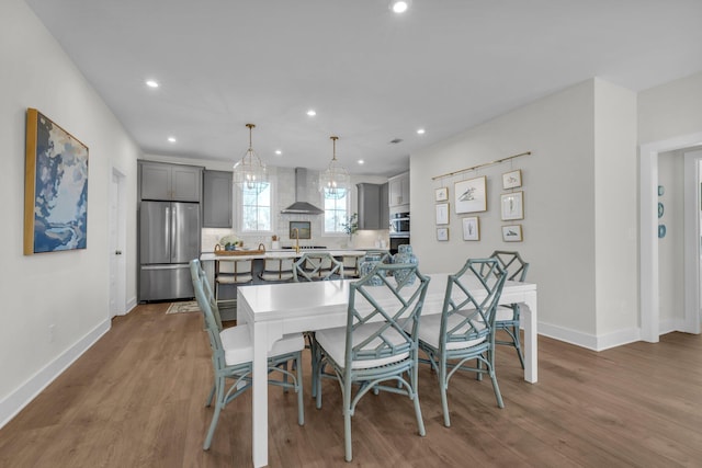 dining space featuring hardwood / wood-style flooring