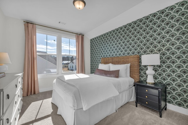 carpeted bedroom with vaulted ceiling