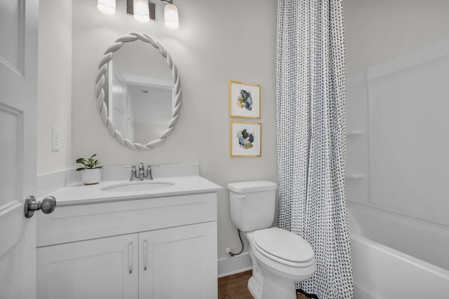 full bathroom with shower / bath combo with shower curtain, toilet, and vanity