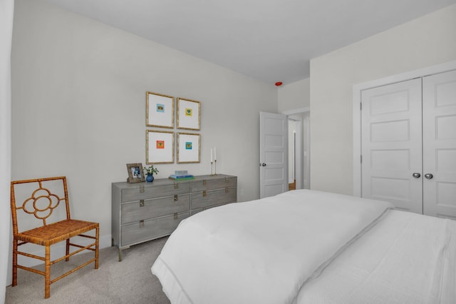 carpeted bedroom featuring a closet