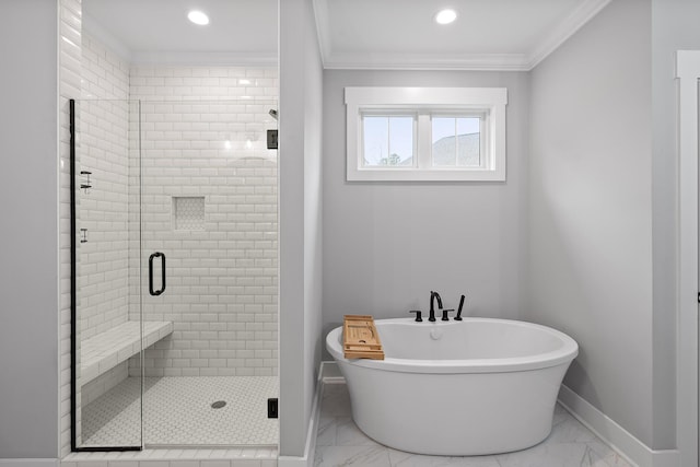 bathroom featuring crown molding and separate shower and tub