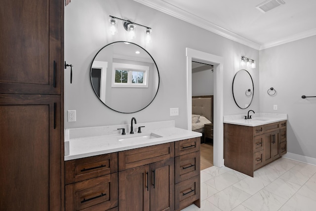 bathroom with crown molding and vanity