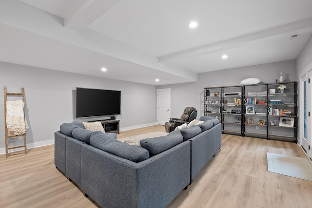 living room featuring light hardwood / wood-style flooring and beam ceiling