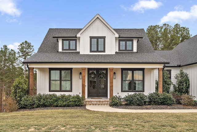 view of front facade with a front lawn and a porch