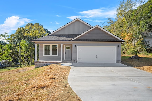 view of front of house with a garage and a front lawn