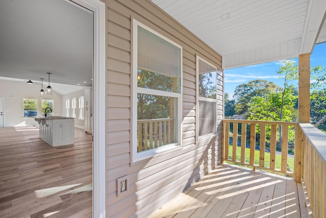 deck featuring sink and ceiling fan