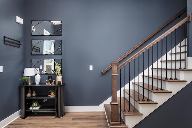 stairs with wood-type flooring