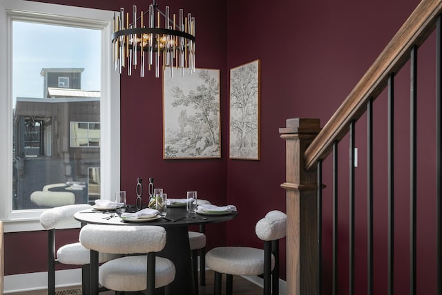 dining area with an inviting chandelier