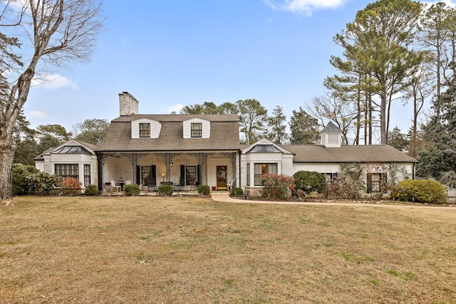 view of front of house featuring a front yard and a porch