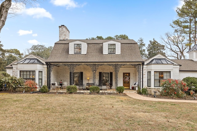 view of front facade with a porch and a front yard