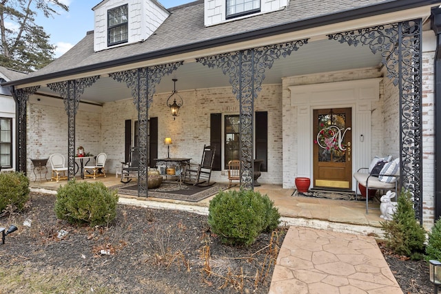 entrance to property featuring covered porch