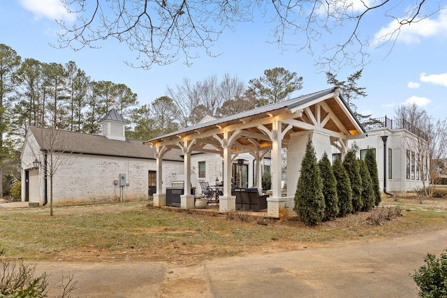 exterior space featuring a gazebo and a garage