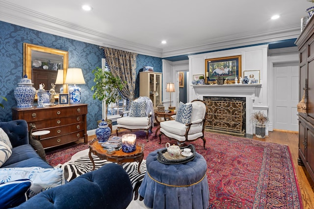 living room featuring crown molding, hardwood / wood-style floors, and a premium fireplace