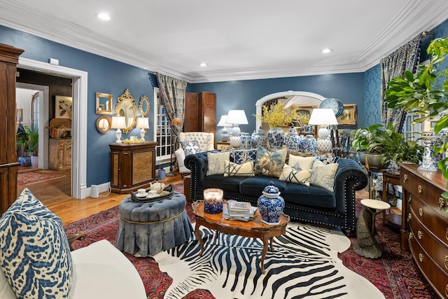 living room featuring light hardwood / wood-style floors and ornamental molding