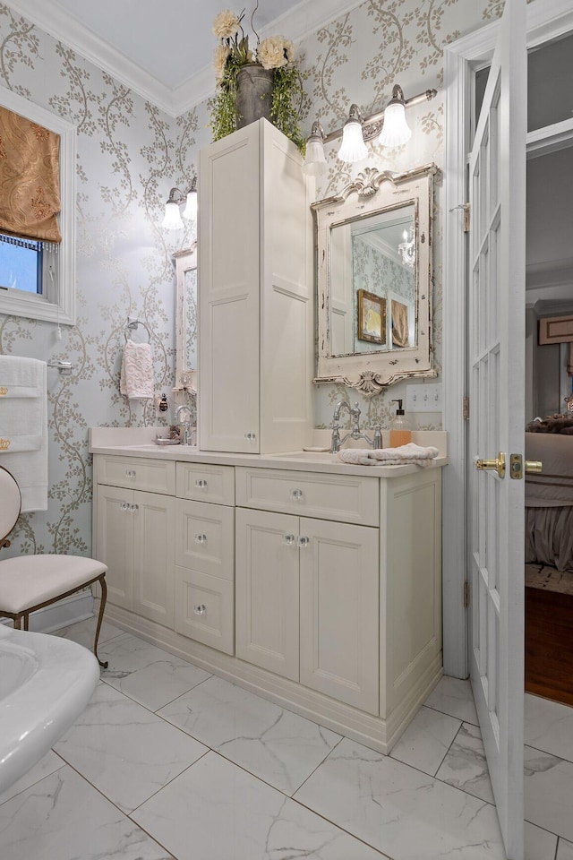 bathroom featuring toilet, vanity, and ornamental molding