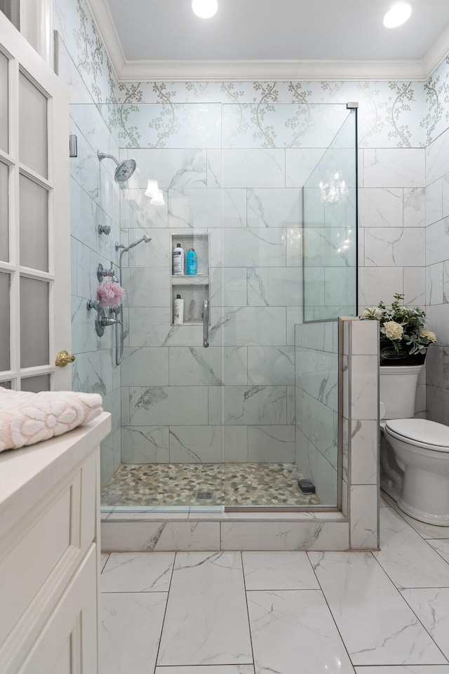 bathroom with an enclosed shower, vanity, crown molding, and toilet