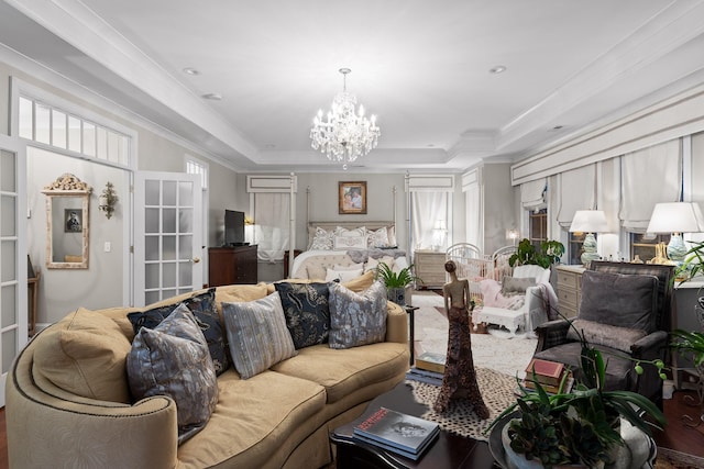 interior space with ornamental molding, a raised ceiling, and a notable chandelier