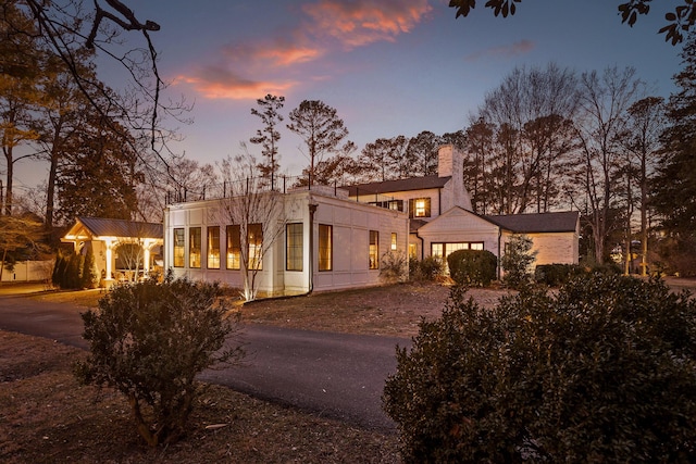 view of front of property featuring a sunroom