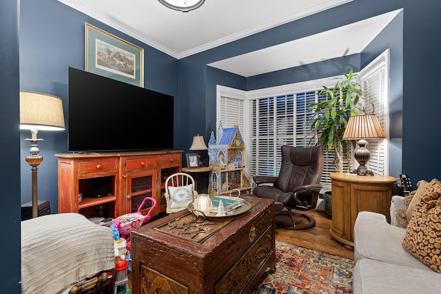 living room with hardwood / wood-style flooring and ornamental molding